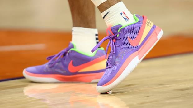 View of Ja Morant's purple and orange shoes.